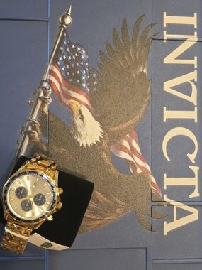 Invicta Gold Tone Watch with Blue Dial Accents